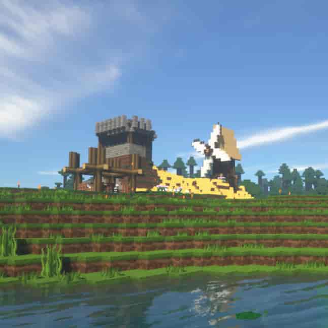 Minecraft with a Windmill and trees in the distance